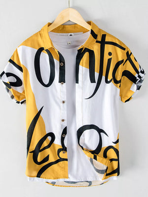 Men's yellow and white abstract script print short sleeve cotton button-up shirt.