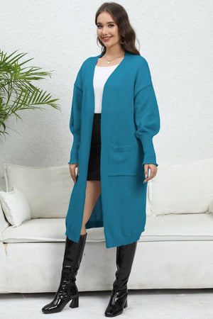 Cerulean oversized pocketed knit cardigan with long sleeves and open front.