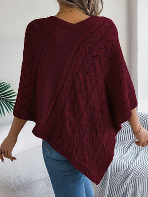 Burgundy cable knit poncho with chevron detail and open knit accents.