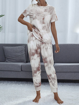 Multicolor tie-dye loungewear set with short sleeve top and drawstring pants.