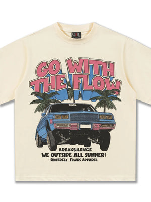 Cream cotton graphic tee with "GO WITH THE FLOW" text, a blue car, and palm trees.