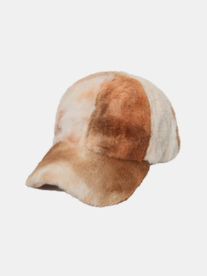 Faux fur baseball cap in caramel and cream with a tie-dye pattern.
