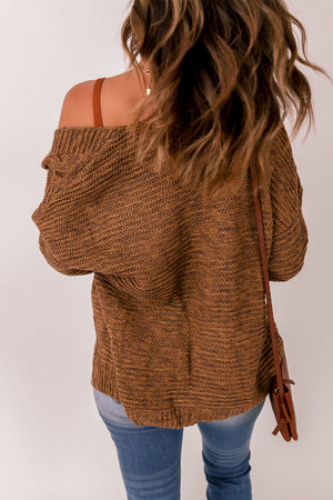 Brown cable knit open-front cocoon cardigan with textured acrylic knit.