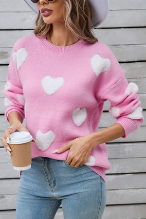 Hot pink crewneck sweater with white heart appliqués, acrylic knit, casual style