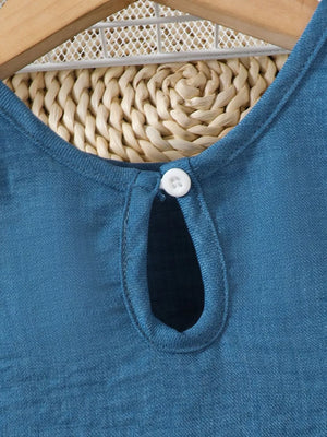 Blue peplum tank with keyhole neckline and button detail