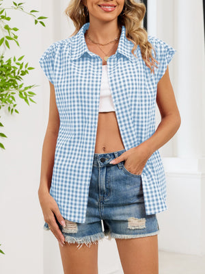 Sky blue gingham cotton shirt with cap sleeves and button-down front.