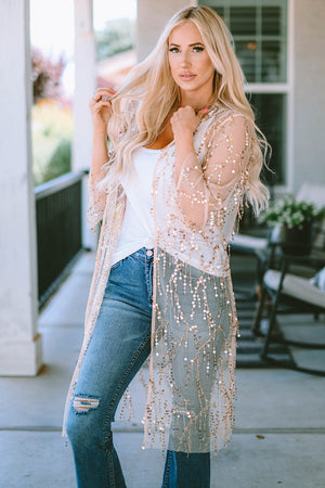 Beige sequin duster with flared sleeves and open front, styled with a white tank and jeans.