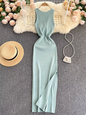 Light blue ribbed knit midi dress with a high slit and sleeveless design.