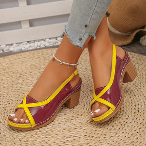 Burgundy and yellow open-toe block heel sandals with crisscross straps and adjustable ankle strap.