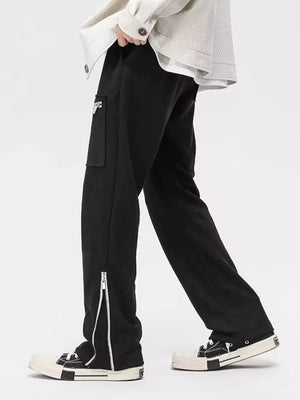 Black relaxed fit sweatpants with cargo pocket and ankle zippers
