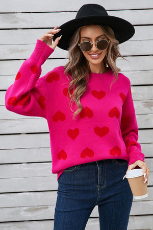 Hot Pink acrylic sweater with red heart intarsia pattern, crew neck, long sleeves.