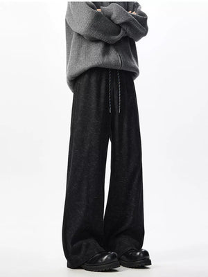 Textured black wide leg drawstring sweatpants with adjustable tie.