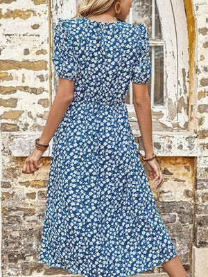 Blue floral midi dress with puff sleeves and a cinched waist