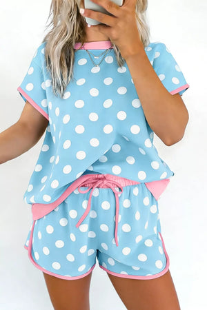 Pastel blue polka dot pajama set with pink contrast trim and drawstring shorts.