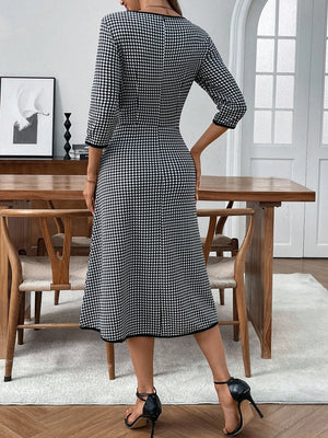 Black and white gingham midi dress with 3/4 sleeves and a-line cut.