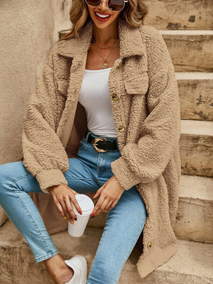 Oversized teddy bear shacket in camel with button-down front and chest pockets.