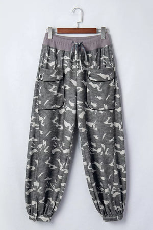 Camouflage barrel pants with cargo pockets and drawstring waist.