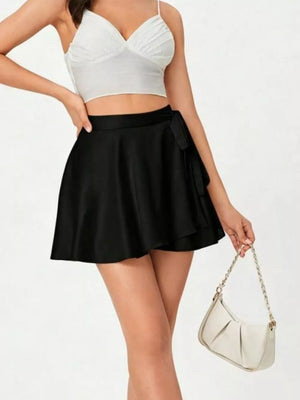 Black A-line mini skirt with tied detail and a ruffled hem.