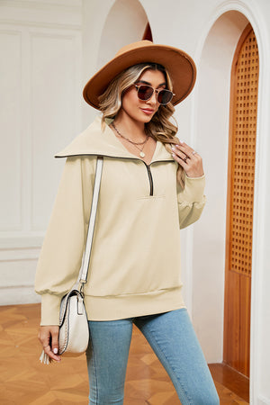Cream wide collar zip-through sweatshirt with a quarter zip and relaxed fit.