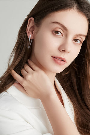 Silver chain cascade bar earrings with a textured bar detail.