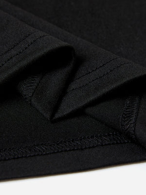 Black t-shirt detail showing fabric texture and stitching