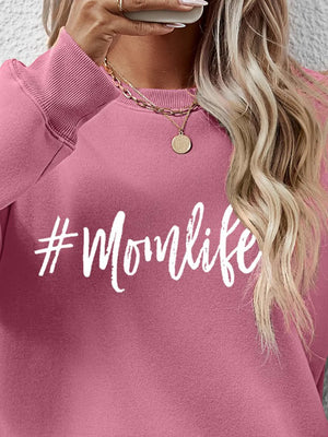 Blush pink crewneck sweatshirt with white #Momlife graphic, crew neck, long sleeves.
