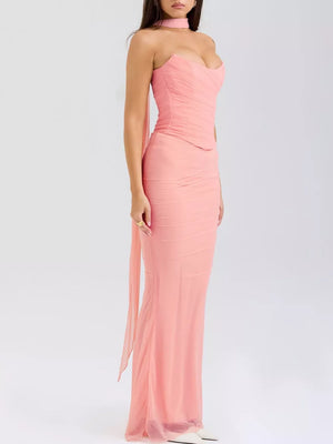 Pink sweetheart tube top and flowy maxi skirt set with ruched bodice and sheer overlay.