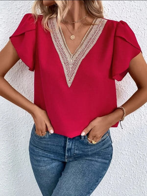 Red lace trim V-neck flutter sleeve blouse styled with jeans
