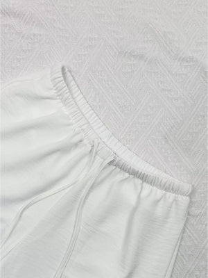 White maternity pants with drawstring waist and relaxed wide leg
