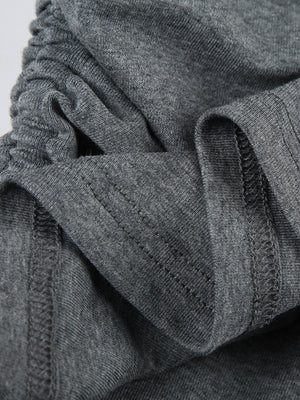 Ruched grey bodycon mini dress detail showing drawstring and stitching