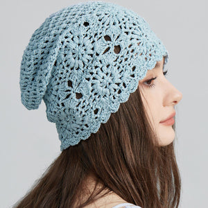 Blue crochet slouchy beanie with floral pattern and scalloped edge