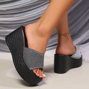 Glitter platform wedge mules in gray with a black espadrille-style wedge sole.
