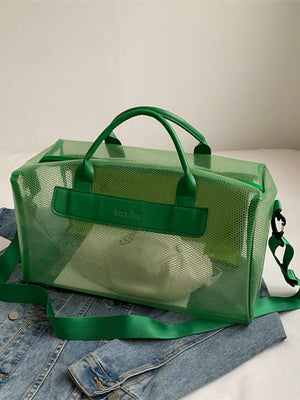 Green mesh travel bag with green straps and handles, clear PVC accents.