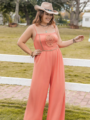 Orange wide leg jumpsuit with embroidered bodice and spaghetti straps