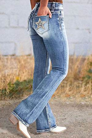 Light wash bootcut jeans with embroidered star detail on back pocket.