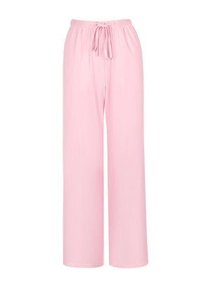 Crinkled wide leg pants in pink with a drawstring waist and relaxed fit.