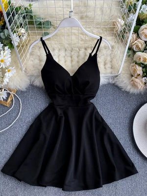 Black V-neck spaghetti strap mini dress with adjustable straps and a flared skirt.