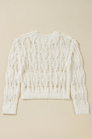 Ivory open-knit crochet crop sweater with a diamond pattern and crew neck.