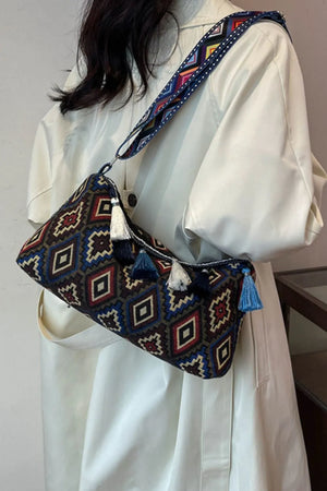 Geometric embroidered shoulder bag with tassels and colorful strap