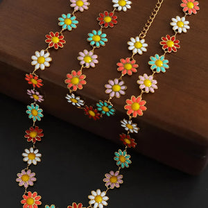 Daisy chain enamel collar necklace with colorful flowers and gold chain detail.