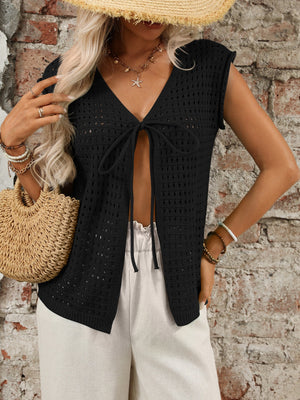 Black open-knit tie-front sleeveless cardigan with V-neck and open stitch detail.
