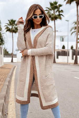Color-blocked hooded knit maxi cardigan in beige with brown and white stripes, featuring pockets.