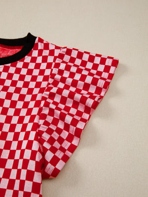 Red and white checkered shirt with ruffle sleeves and black trim neckline.