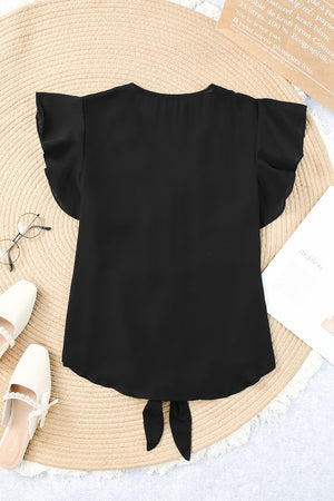Black tie-front blouse with ruffle sleeves and a curved hem.