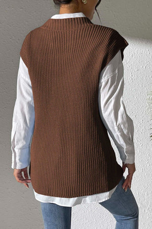 Chocolate textured knit V-neck sleeveless vest over a white button-down shirt.