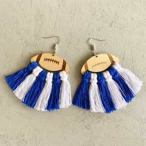 Macrame football tassel earrings in blue and white with wooden football tops.