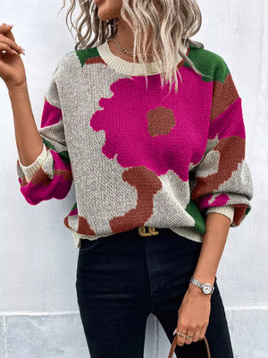 Abstract floral knit sweater with round neck in hot pink, green, brown, and beige.
