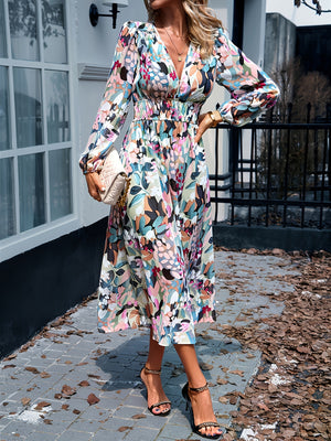 Floral print midi dress with V-neck, long sleeves, and smocked waist.