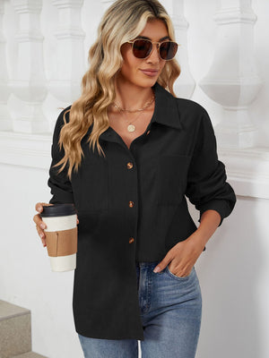 Black corduroy overshirt with patch pockets and button front, worn by a model holding a coffee cup.