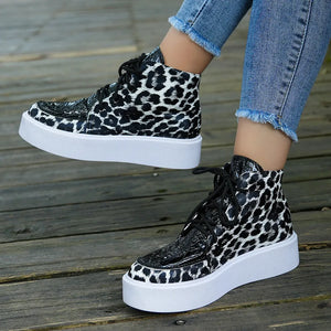 Patent leopard platform high-tops with black patent accents and white soles.